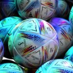 Eye-catching display of vibrant FIFA World Cup soccer balls, highlighting sports equipment details.